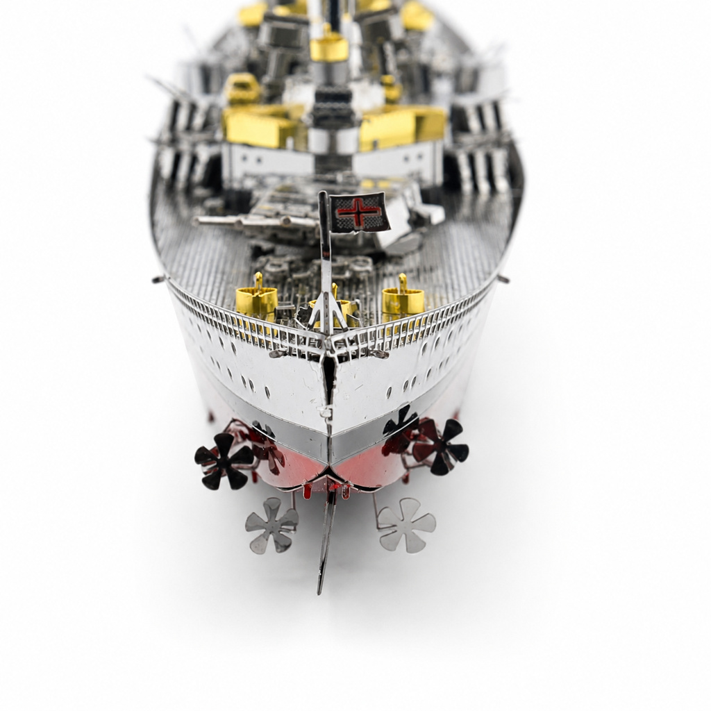 Stern view of a detailed ship model with golden and metallic elements.