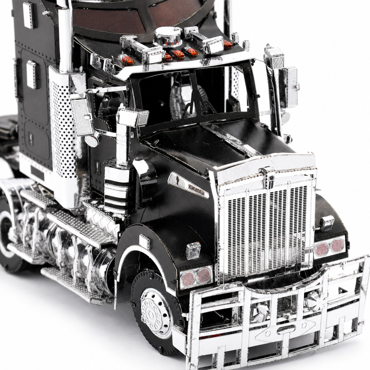 Detailed model of a black truck with chrome accents.