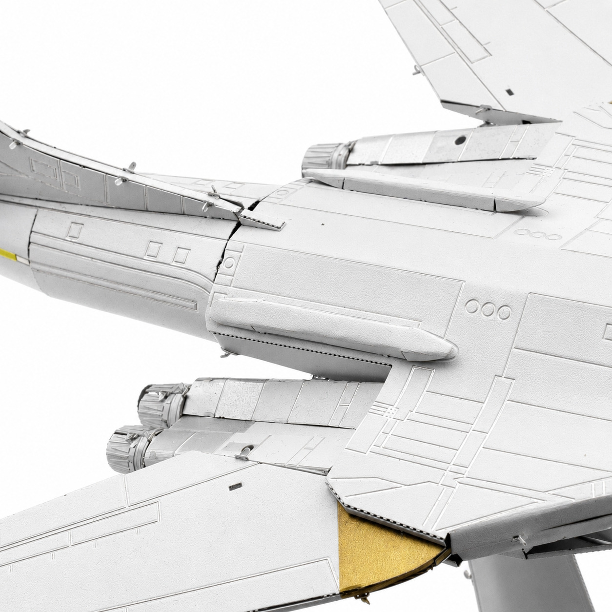Detailed view of a model aircraft wing with intricate features.