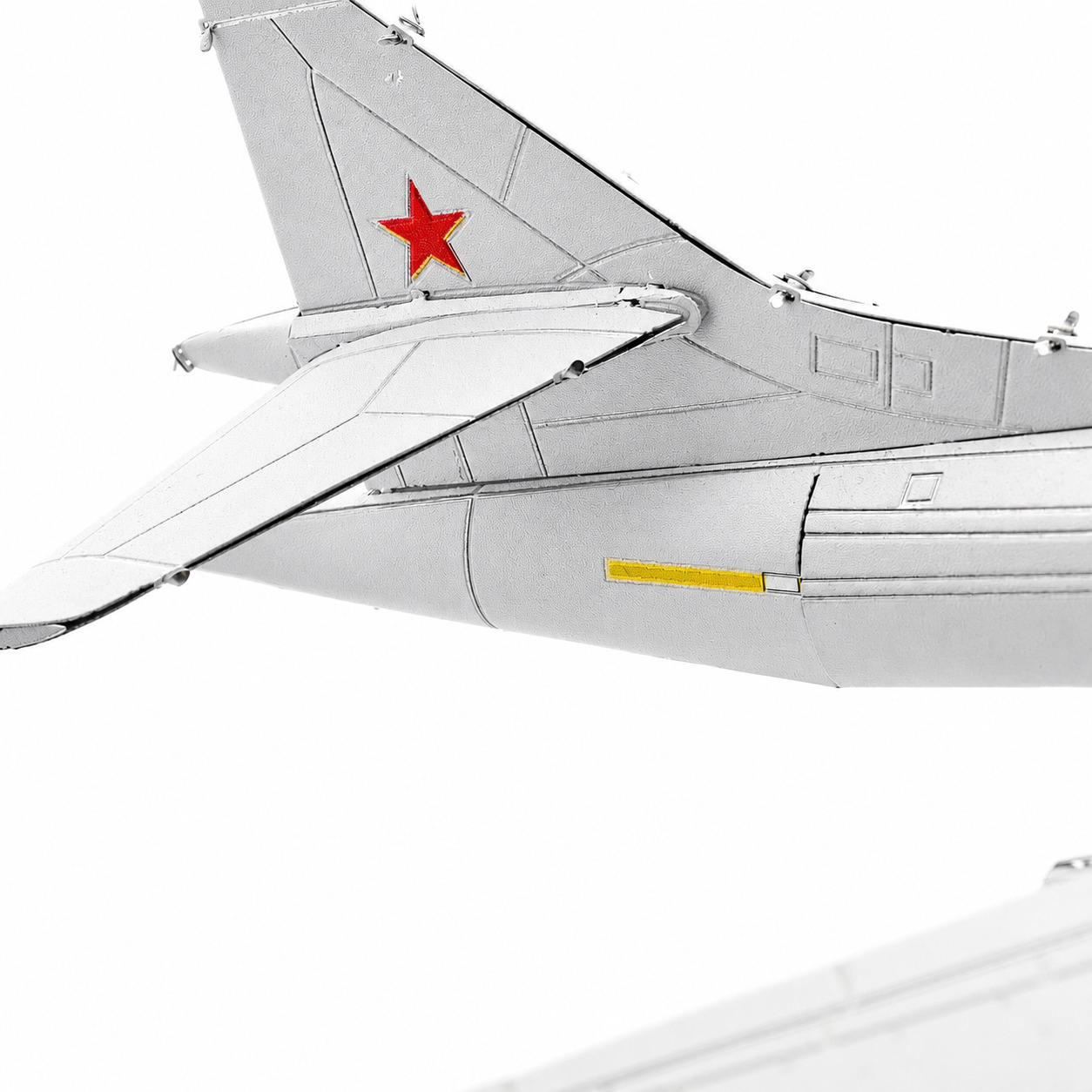 Tail section of a model airplane featuring a red star detail.