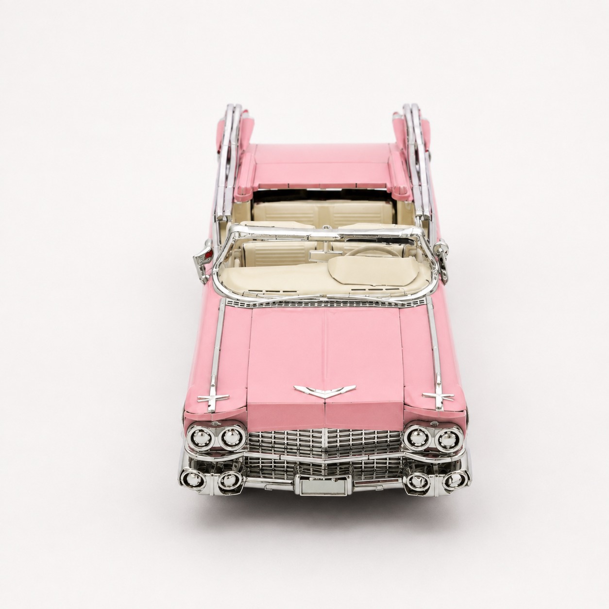 Classic pink convertible car from a top view.